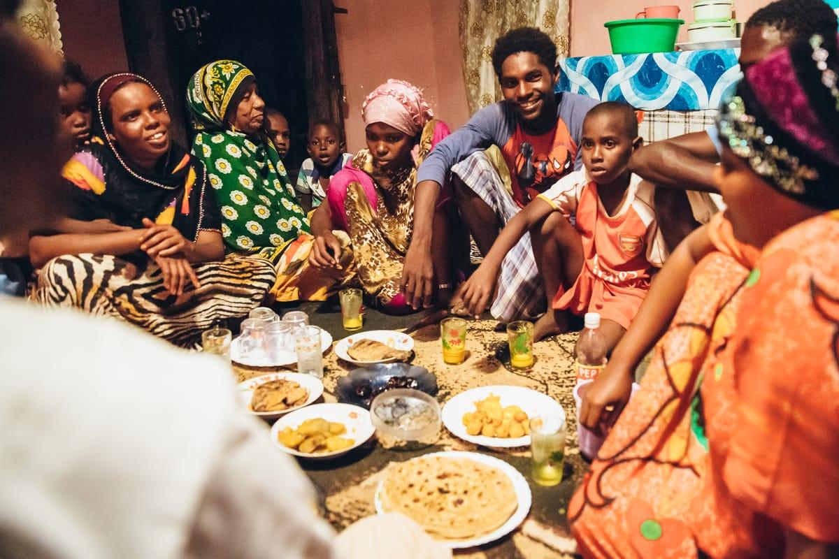 WWF marine turtle conservation volunteer, Said, shares a meal with his family. Mkokoni, Lamu seascape, Kenya